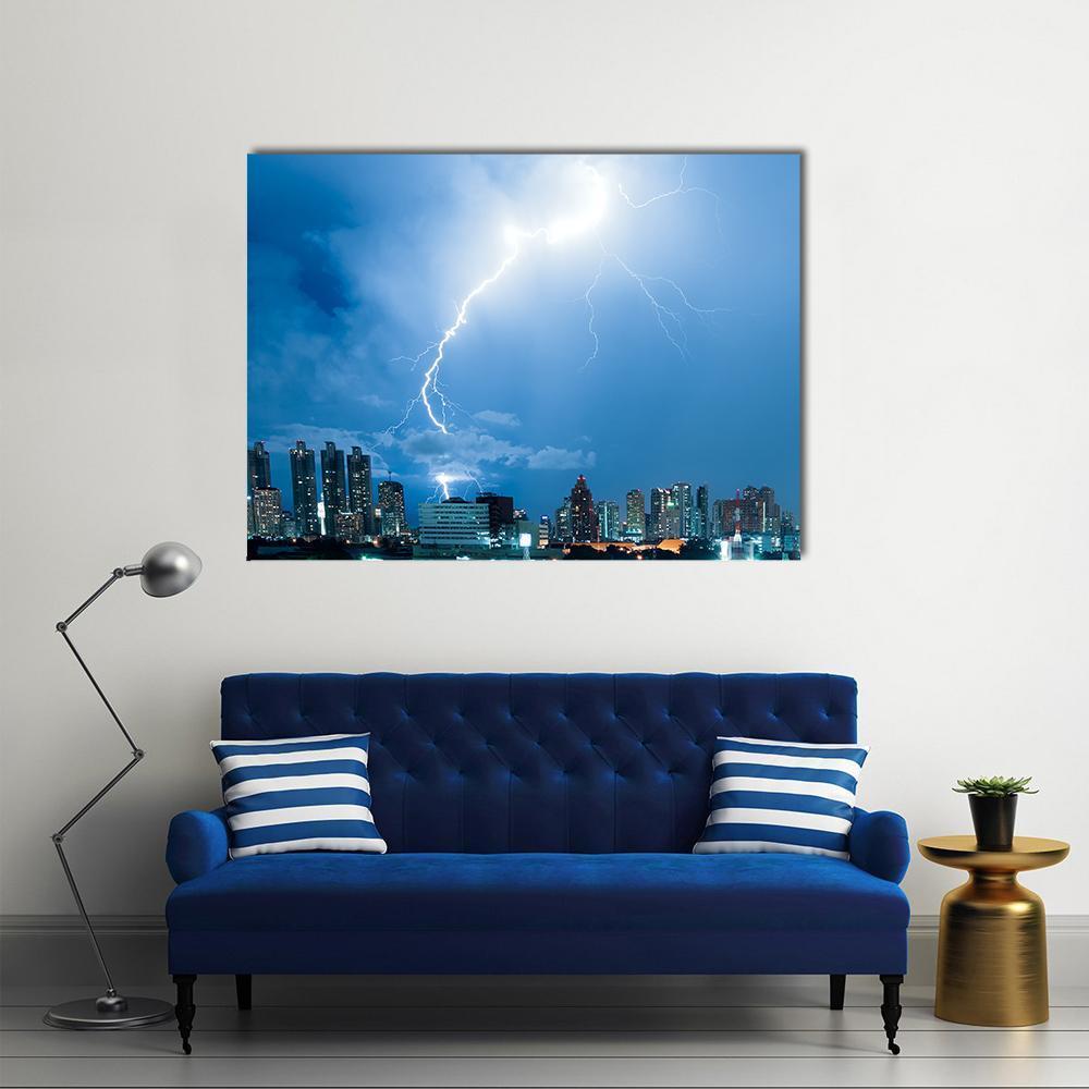 Lightning Strike Over City Skyline Canvas Wall Art in white and blue, single panel hung on a wall