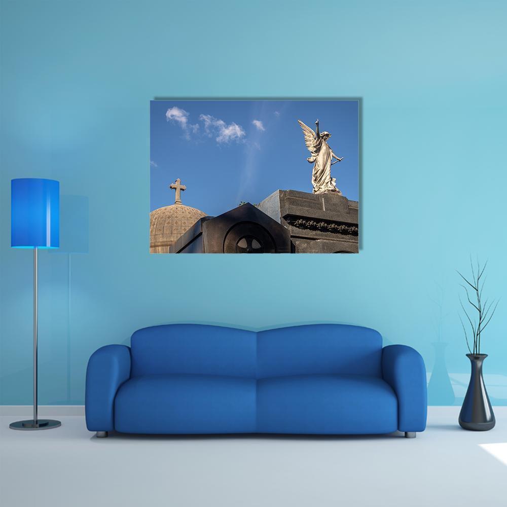 Recoleta Cemetery Angel Statue Canvas Wall Art in gray and blue, single panel hung on a wall