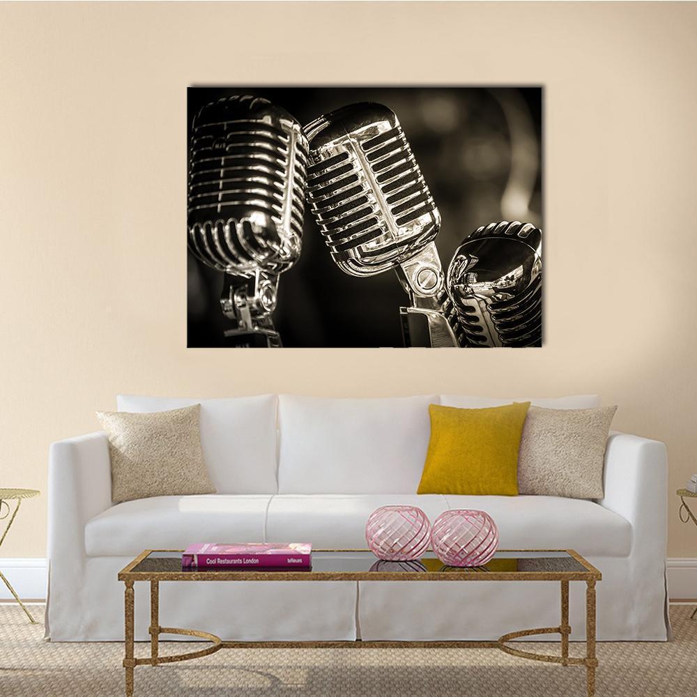 Three Vintage Studio Microphones Canvas Wall Art in black, gray and silver, single panel hung on a wall