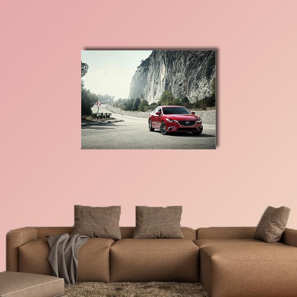 Red Sedan on Mountain Road Canvas Wall Art in white, gray and red, single panel hung on a wall