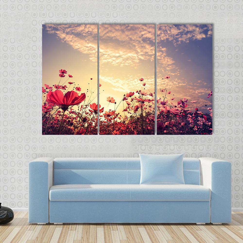 Red Cosmos Flower Field with Sunshine Canvas Wall Art in red, yellow and pink, 4 panel Pop layout hung on a wall