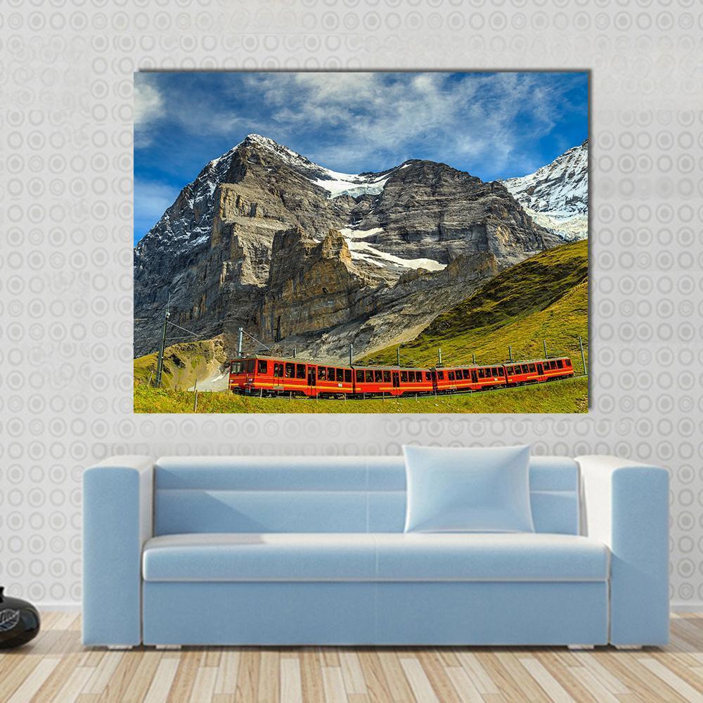 Red Electric Train Switzerland Canvas Wall Art in gray, green and blue, single panel hung on a wall