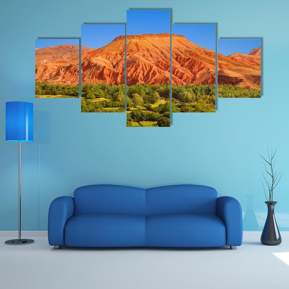 Red Hill Over Dades Valley Canvas Wall Art in orange, green and blue, 5 panel Star layout hung on a wall