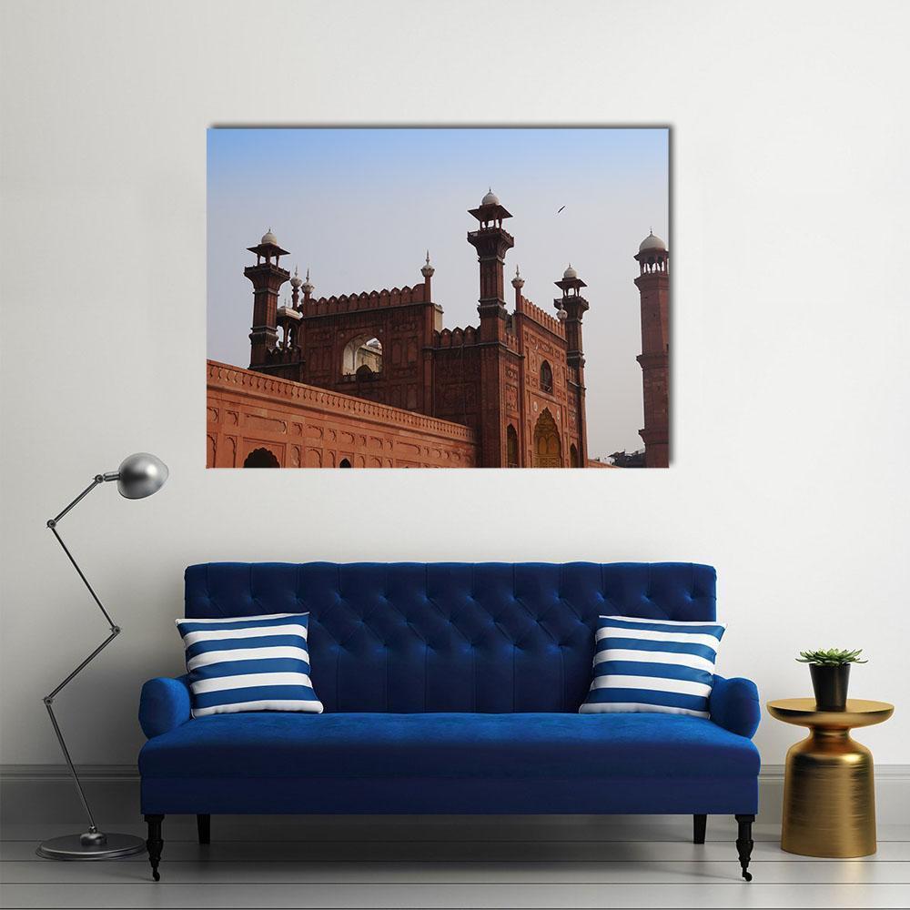 Red Mosque in Lahore Canvas Wall Art in brown, red and blue, single panel hung on a wall
