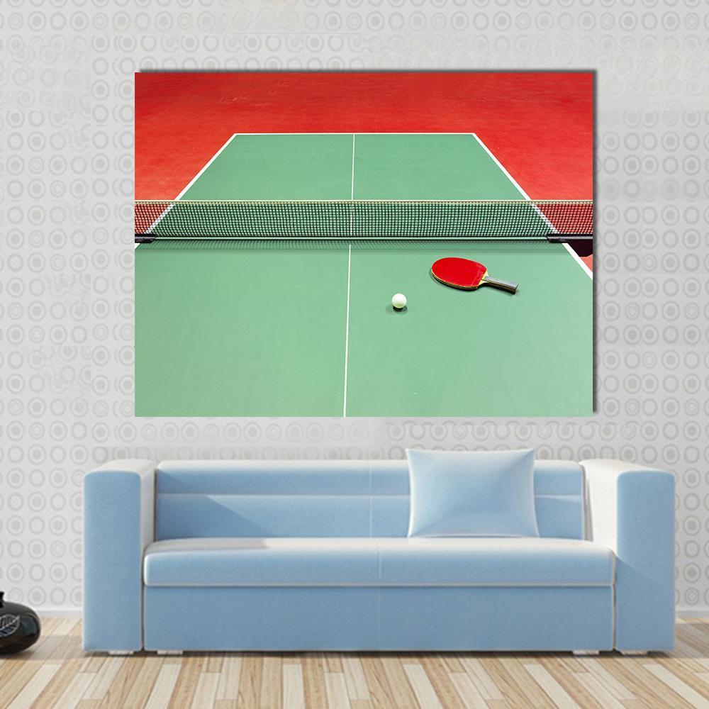 Red Table Tennis Paddle and Ball Canvas Wall Art in red and green, single panel hung on a wall