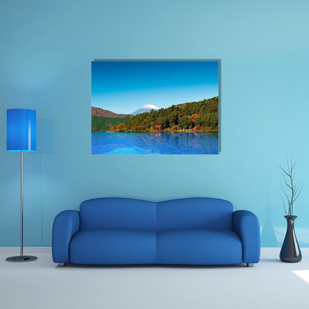 Red Torii Gate on Lake Ashi Canvas Wall Art in green and blue, single panel hung on a wall