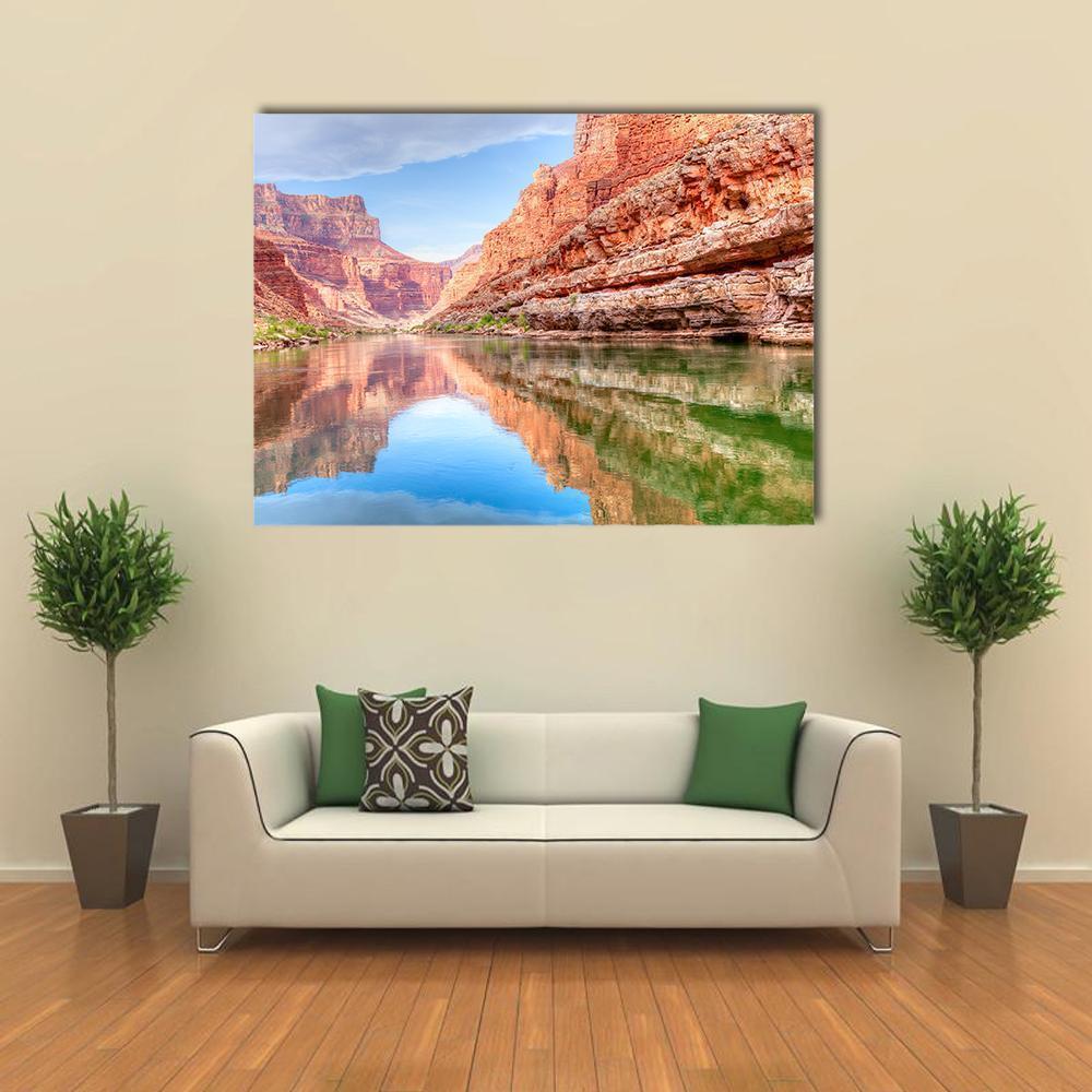 Reflection of Grand Canyon in Colorado River Canvas Wall Art in brown, orange and blue, single panel hung on a wall
