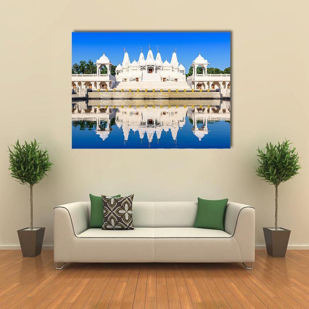 White Ornate Hindu Temple with Water Reflection Canvas Wall Art in white and blue, single panel hung on a wall