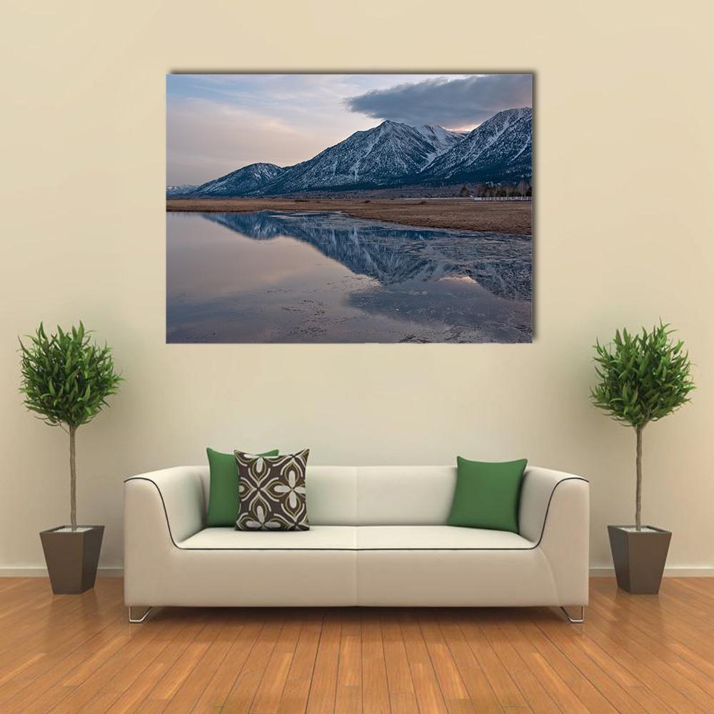 Snow-capped Peaks Reflected at Sunset Canvas Wall Art in gray, brown and blue, single panel hung on a wall
