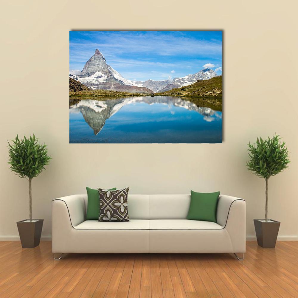 Matterhorn Reflection in Lake Canvas Wall Art in white, gray and blue, single panel hung on a wall