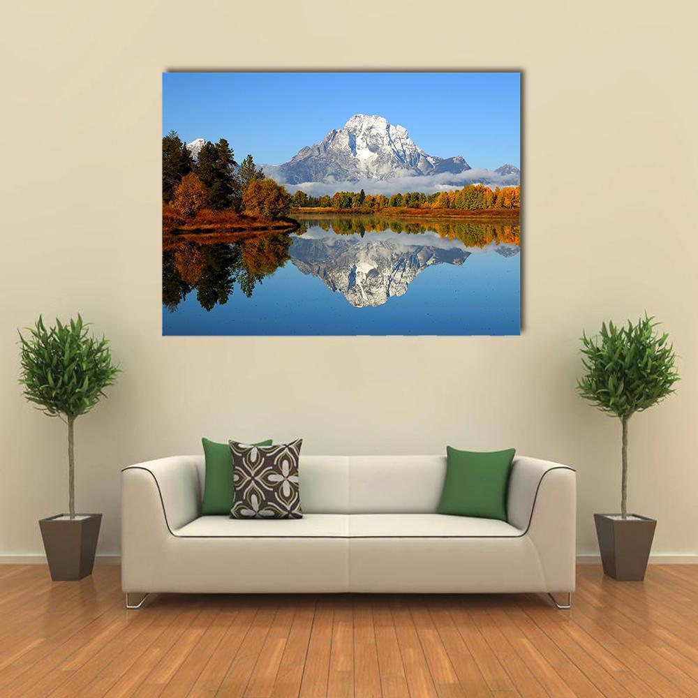 Mountain Reflection in Autumn Lake Canvas Wall Art in brown, orange and blue, single panel hung on a wall