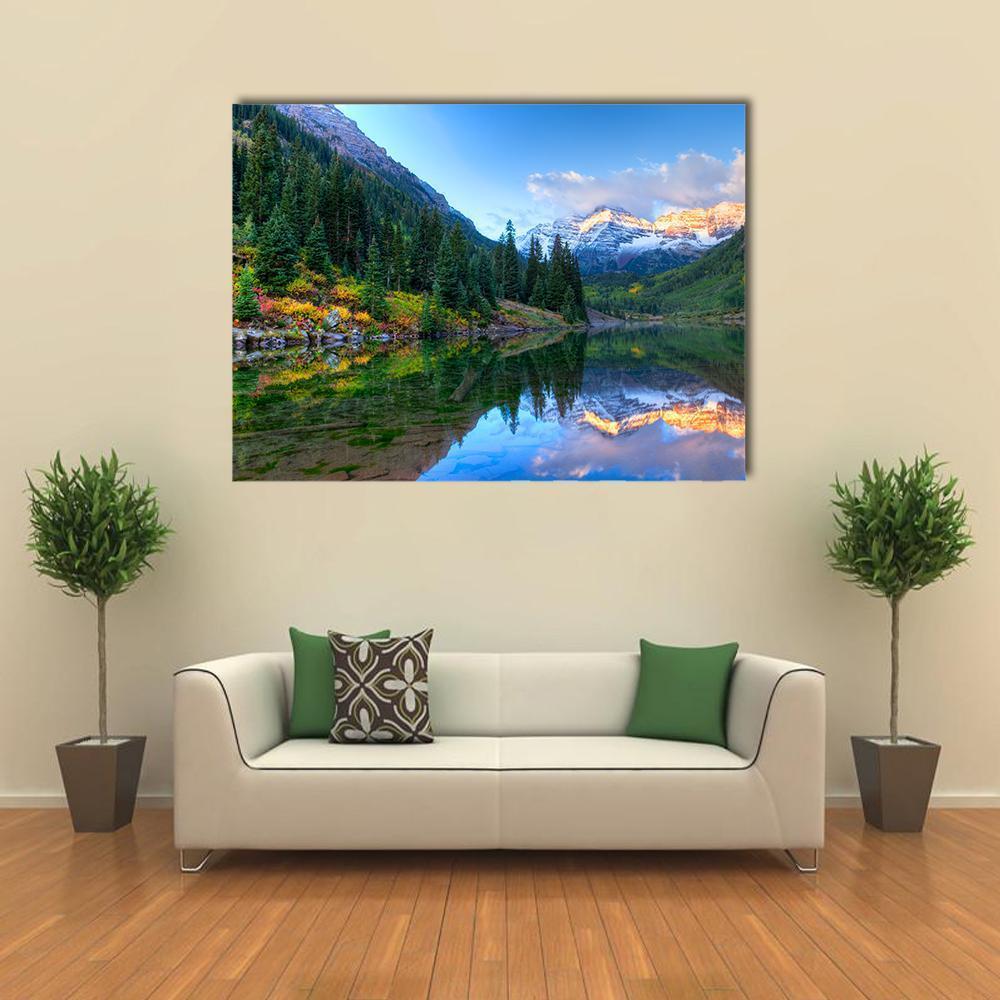 Autumn Reflection of Maroon Bells Canvas Wall Art in green and blue, single panel hung on a wall