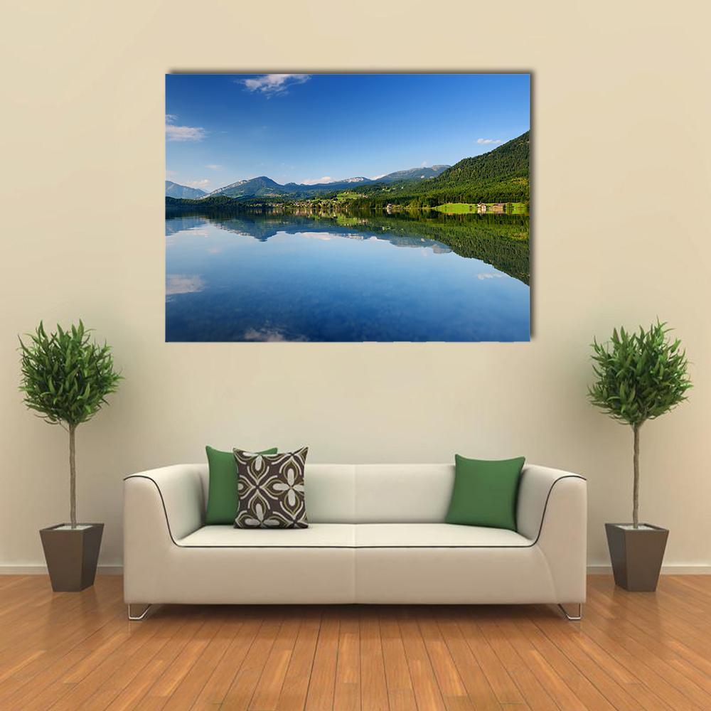 Calm Reflections of Hallstatt Lake Canvas Wall Art in green and blue, single panel hung on a wall