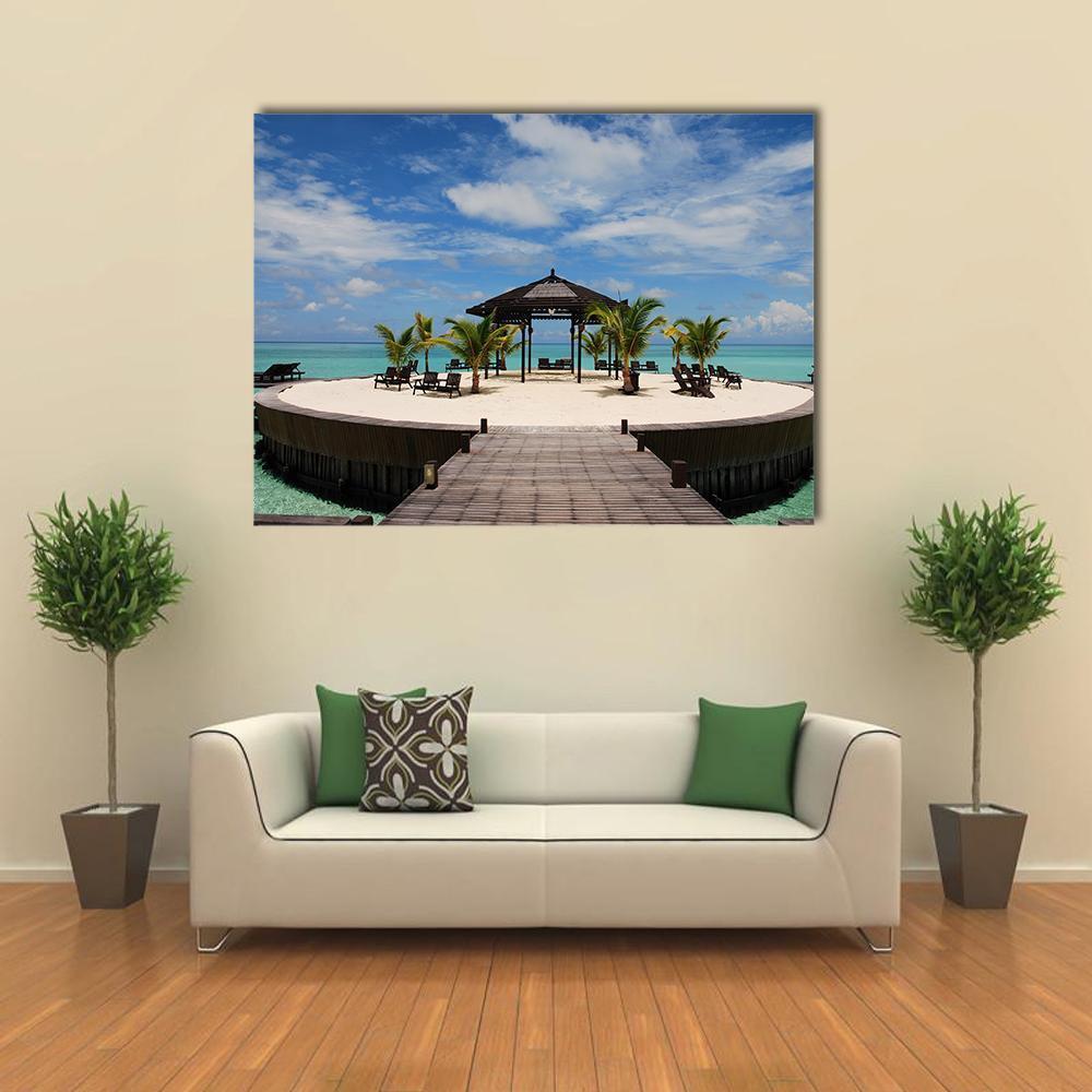 Tropical Island Pier with Gazebo Canvas Wall Art in white, brown and blue, single panel hung on a wall