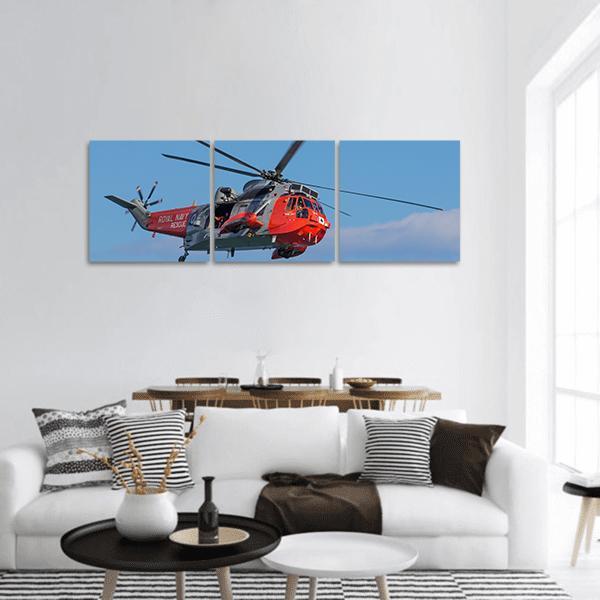Royal Navy Sea King Rescue Helicopter Panoramic Canvas Wall Art in gray, red and blue, hung on a wall