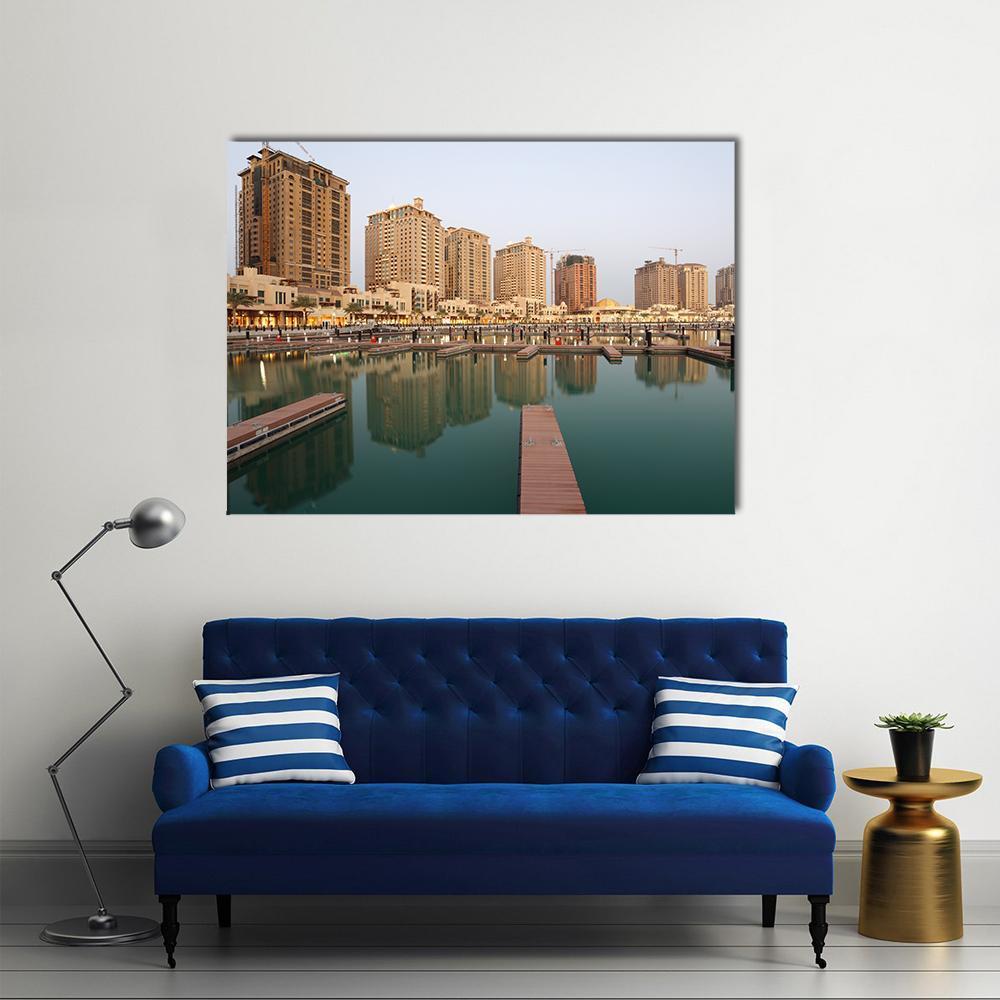 Empty Marina at Dusk with Residential Buildings Canvas Wall Art in beige, brown and blue, single panel hung on a wall