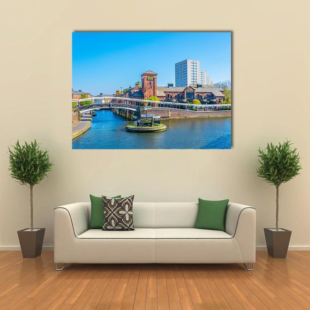 Canal Cityscape with Arched White Bridge Canvas Wall Art in gray, brown and blue, single panel hung on a wall