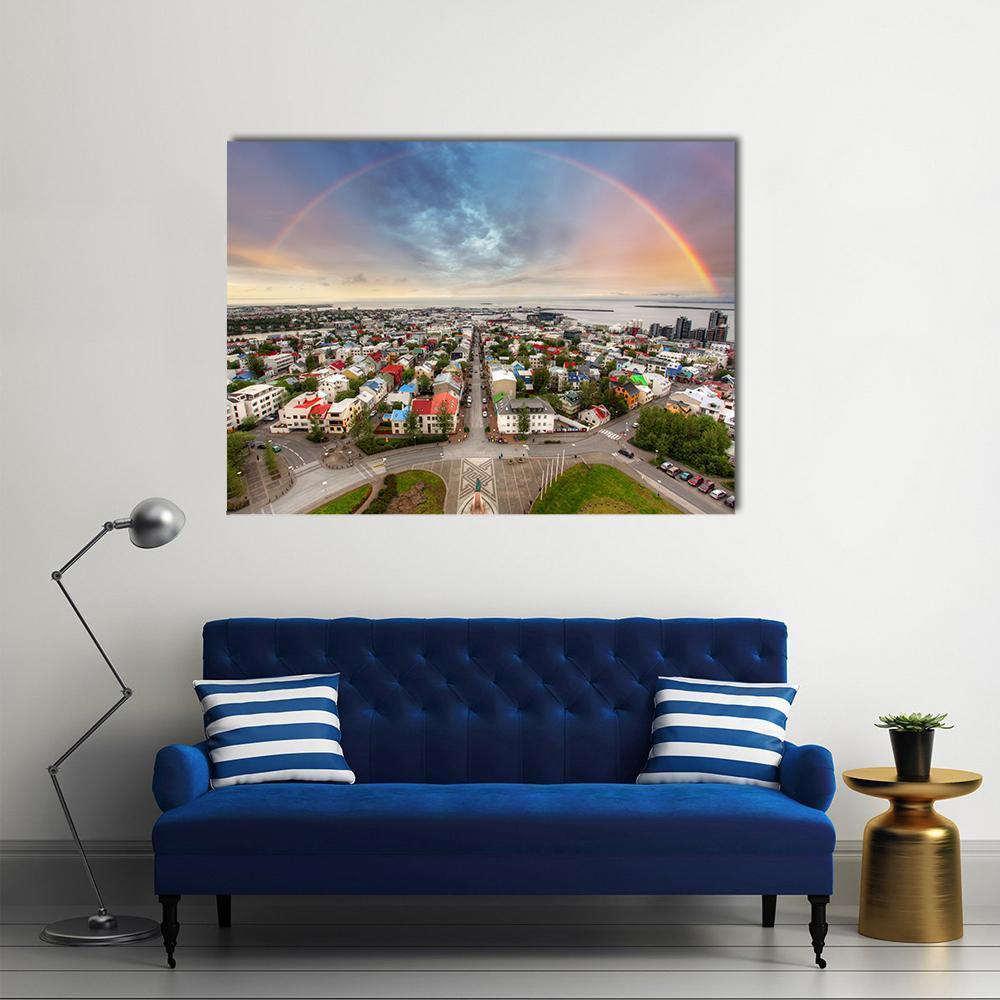 Reykjavik Double Rainbow Cityscape Canvas Wall Art in gray, green and blue, single panel hung on a wall