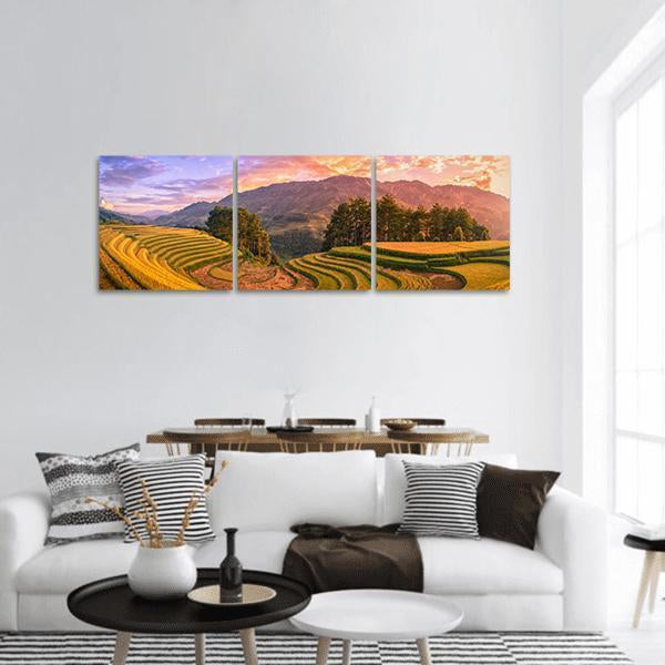 Vietnam Terraced Rice Fields at Sunset Panoramic Canvas Wall Art in orange, yellow and green, hung on a wall
