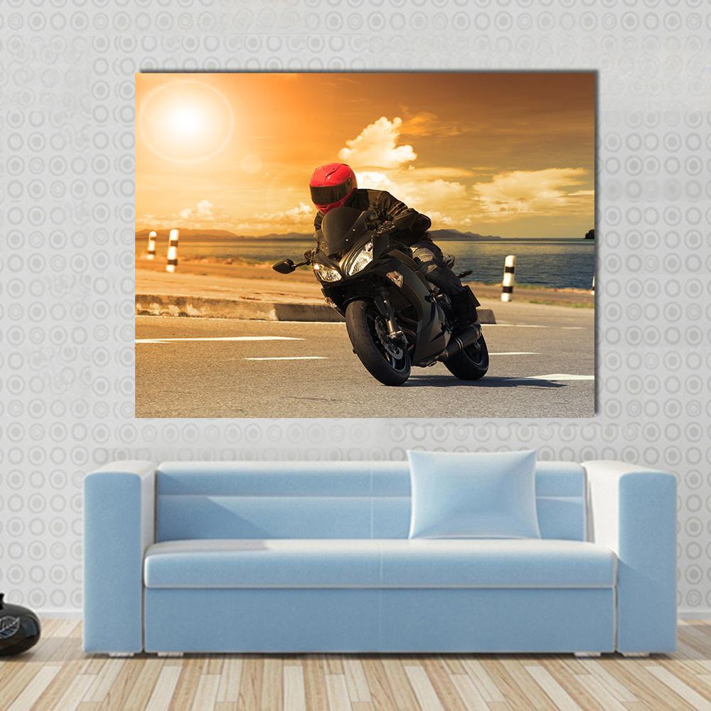 Rider with Rural Lake Canvas Wall Art in black, orange and yellow, single panel hung on a wall