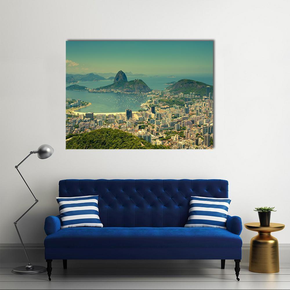 Rio De Janeiro Sugarloaf Mountain Aerial View Canvas Wall Art in yellow, green and blue, single panel hung on a wall