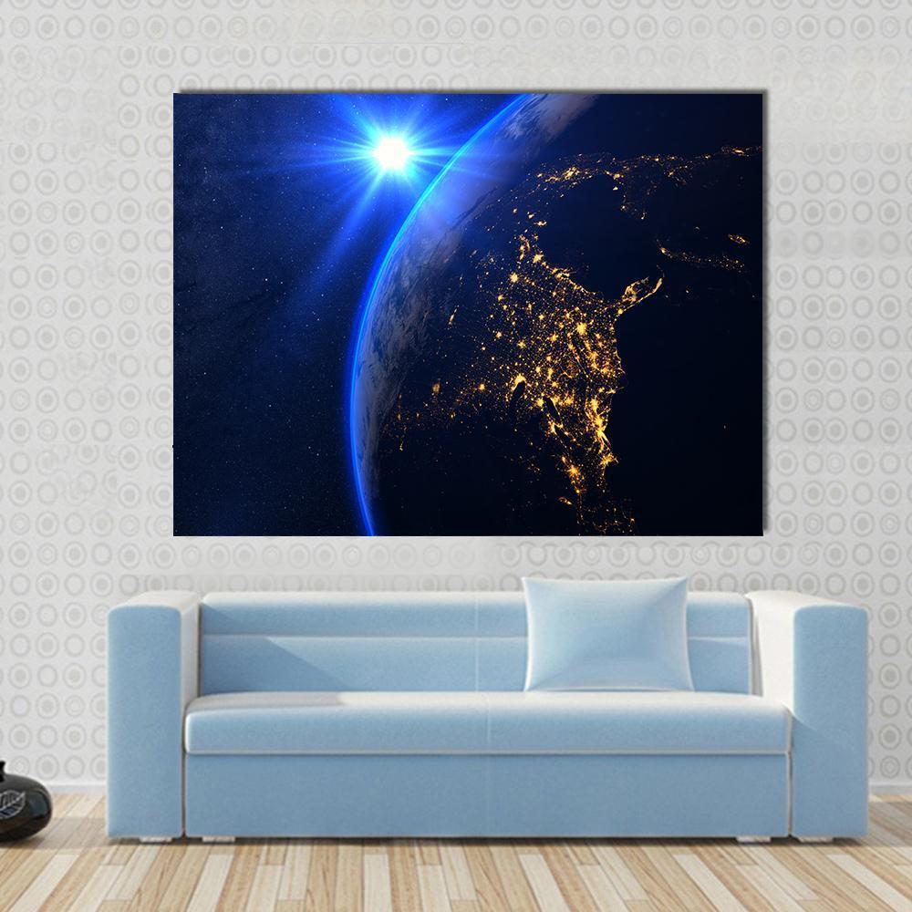 Rising Blue Sun on Planet Earth Canvas Wall Art in black, gold and blue, single panel hung on a wall