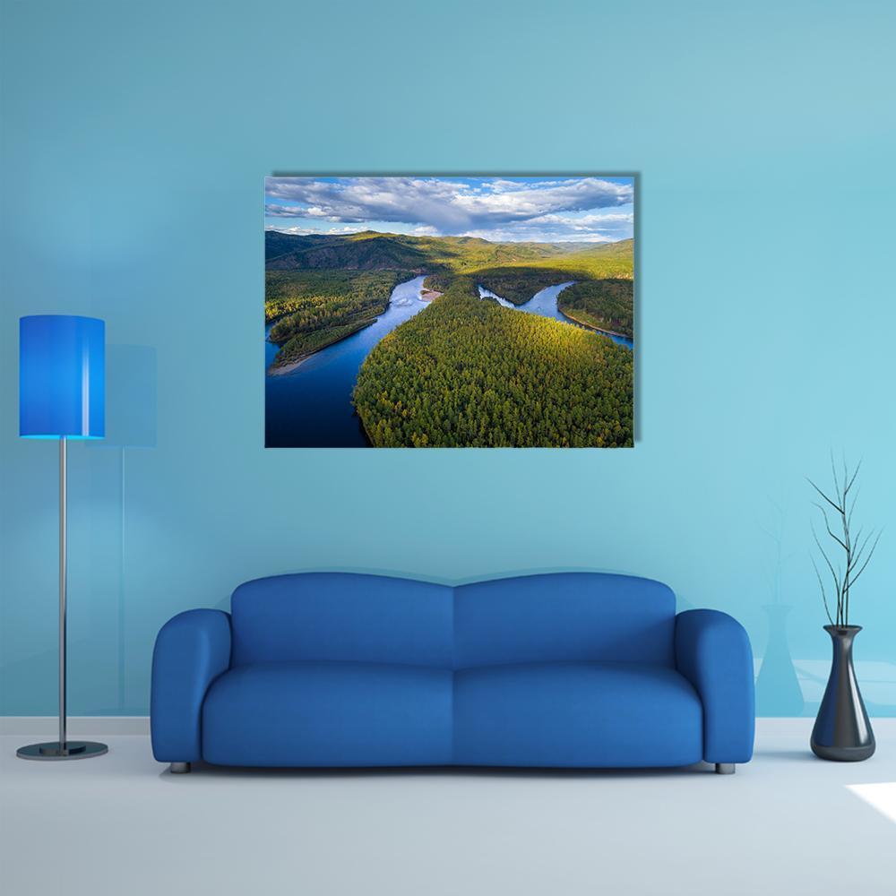 Winding River and Forest Canvas Wall Art in green and blue, single panel hung on a wall