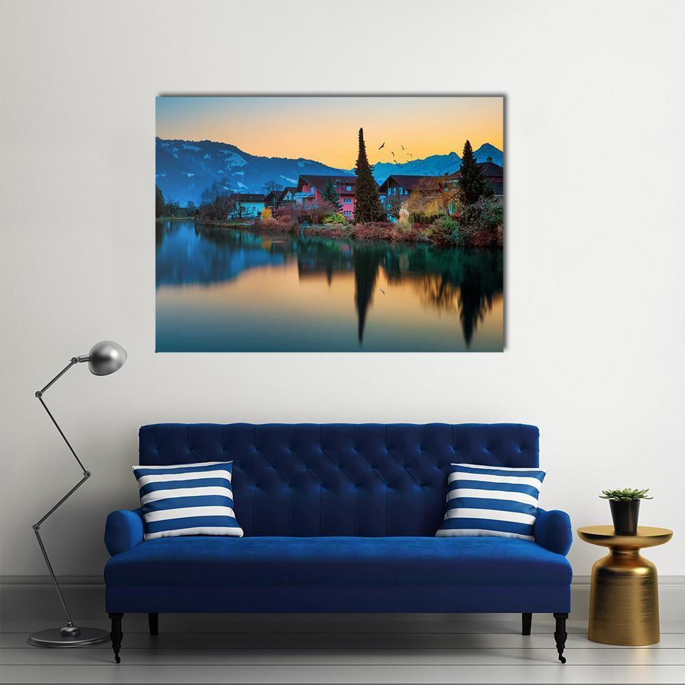 House by Mountain River and Lake Canvas Wall Art in orange, yellow and blue, single panel hung on a wall