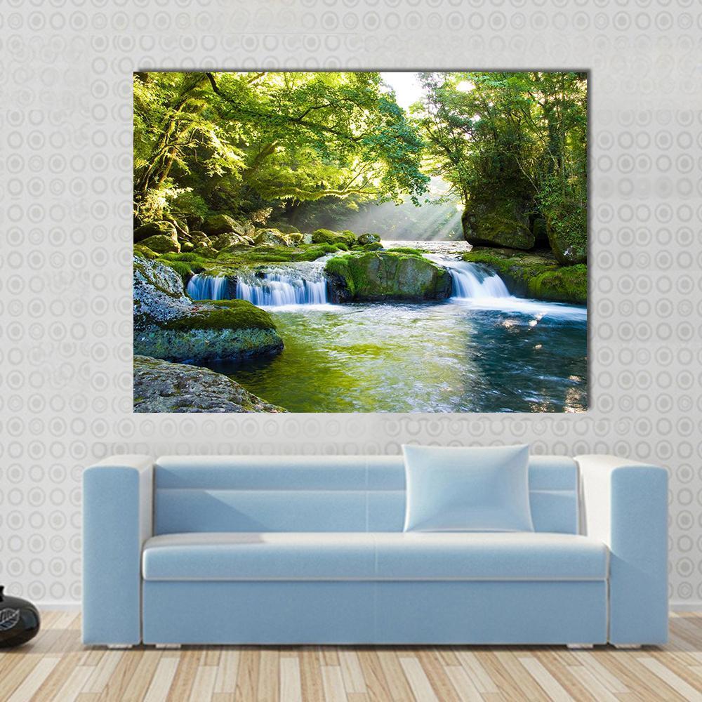 River and Shaft Beam of Light Canvas Wall Art in yellow, green and blue, single panel hung on a wall
