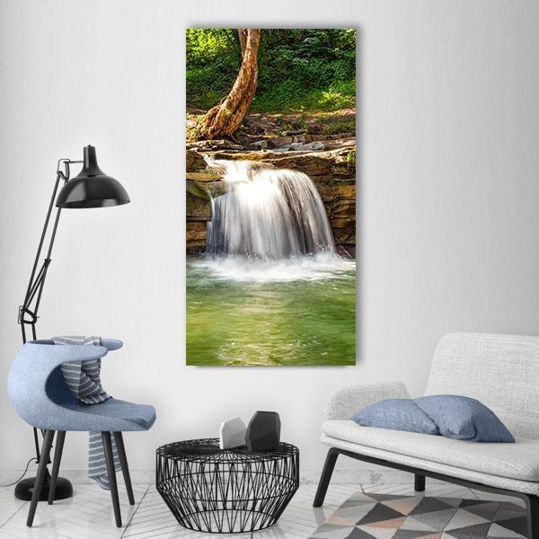 River Cascade Waterfall Vertical Canvas Wall Art in white, brown and green, single vertical panel hung on a wall