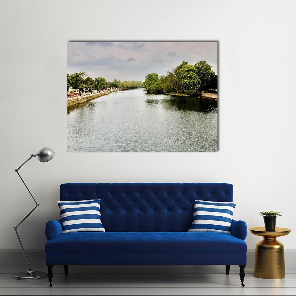 Riverside Path with Walkers Canvas Wall Art in white, gray and green, single panel hung on a wall