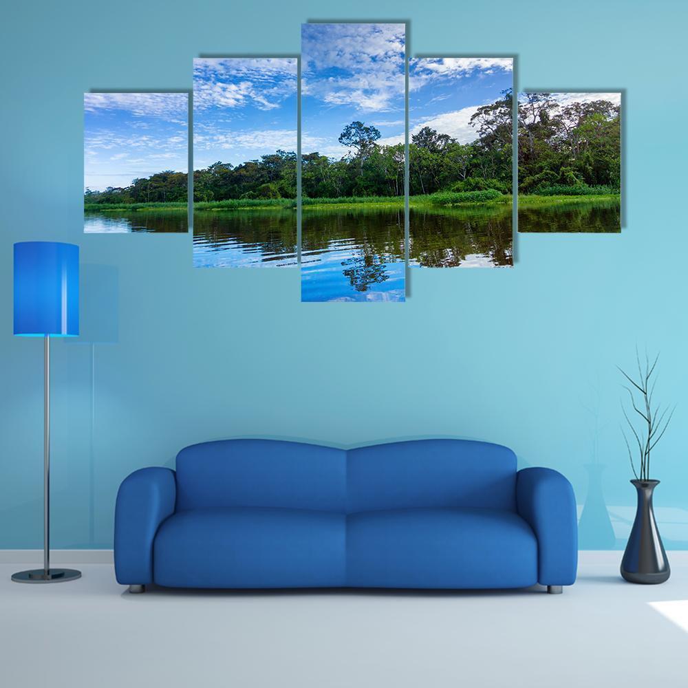 Rainforest River with Calm Water Reflections Canvas Wall Art in white, green and blue, 5 panel Star layout hung on a wall