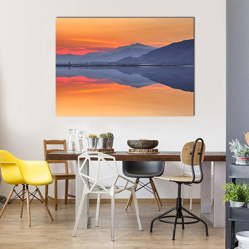 Sunset Reflection on River Swat Canvas Wall Art in red, orange and blue, single panel hung on a wall