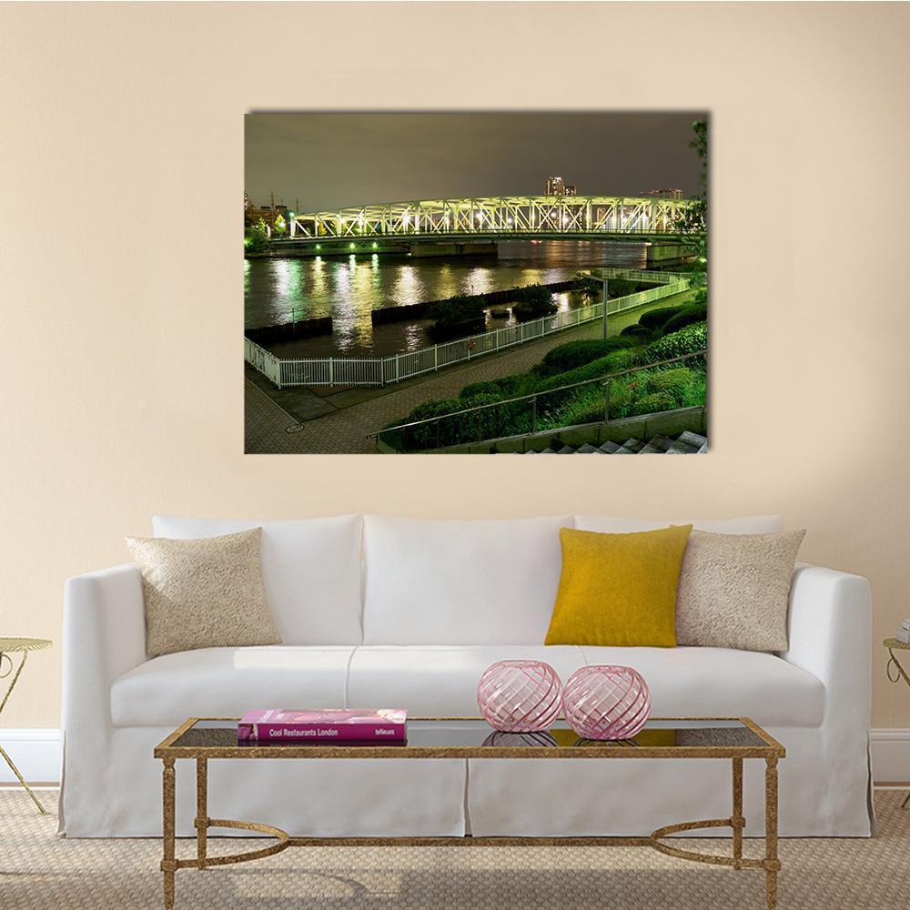 Japanese Riverside Promenade at Night Canvas Wall Art in black, yellow and green, single panel hung on a wall