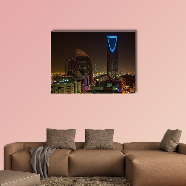 Riyadh Night Skyline Canvas Wall Art in black, yellow and blue, single panel hung on a wall