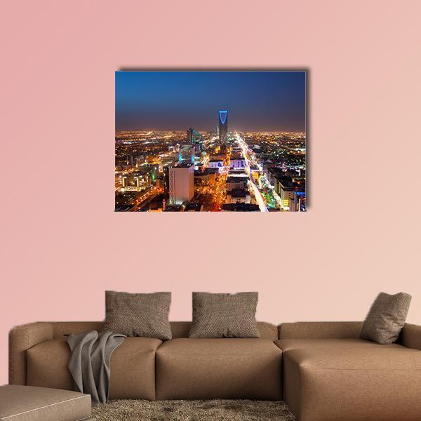 Riyadh Skyline at Night Canvas Wall Art in black, gold and blue, single panel hung on a wall