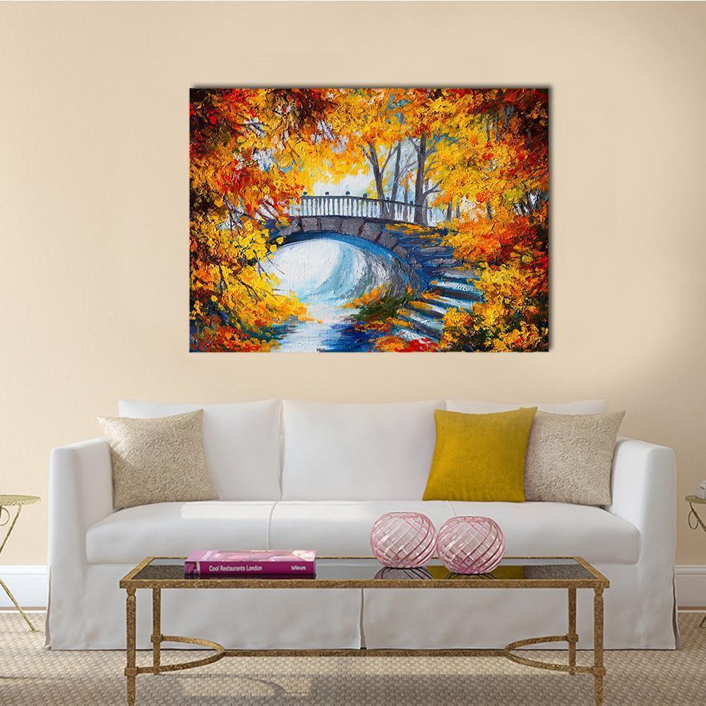 Autumn Road and Forest Bridge Canvas Wall Art in red, orange and yellow, single panel hung on a wall