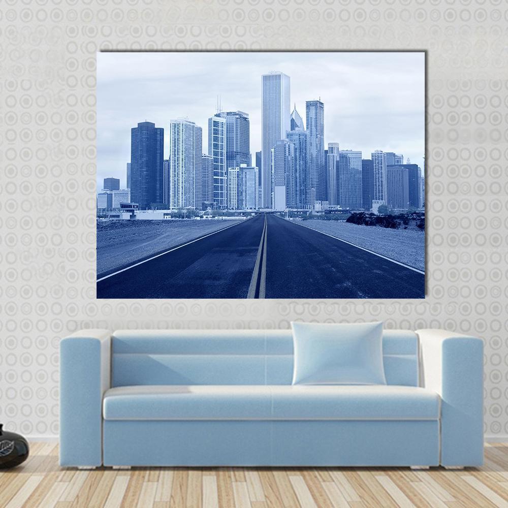Road Approaching City Skyscrapers Canvas Wall Art in white, blue and navy, single panel hung on a wall