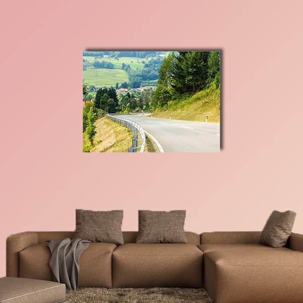 Road Curves in Austrian Mountains Canvas Wall Art in gray and green, single panel hung on a wall