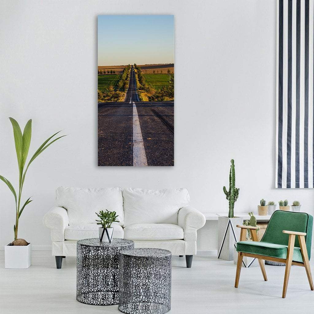 Summer Road in Isparta, Turkey Vertical Canvas Wall Art in black, green and blue, single vertical panel hung on a wall