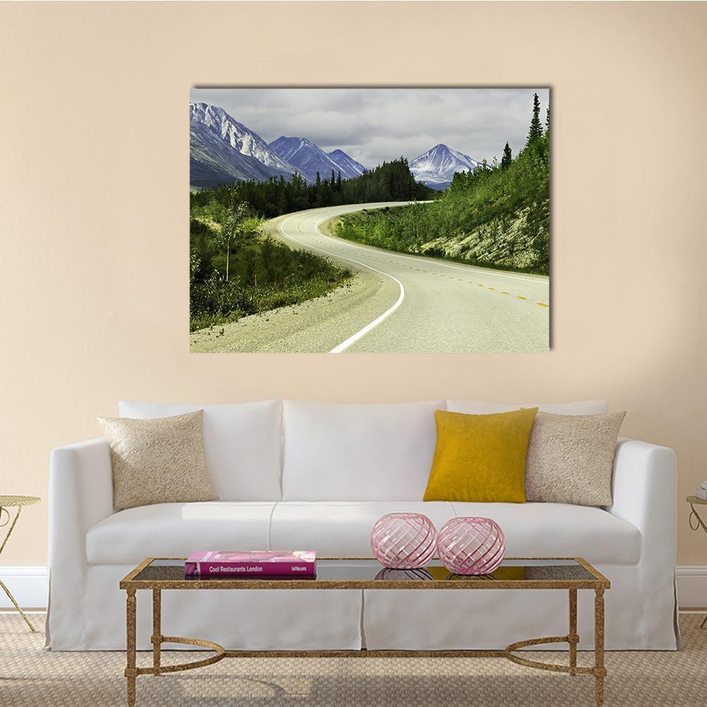 Winding Mountain Road with Yellow Centerline Canvas Wall Art in gray, green and blue, single panel hung on a wall