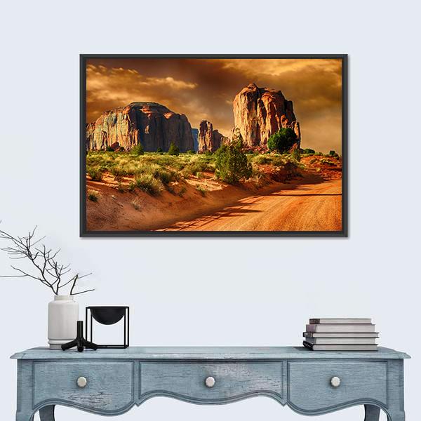 Road Through Monument Valley Canvas Wall Art in brown, orange and yellow, framed canvas, product view on a white background
