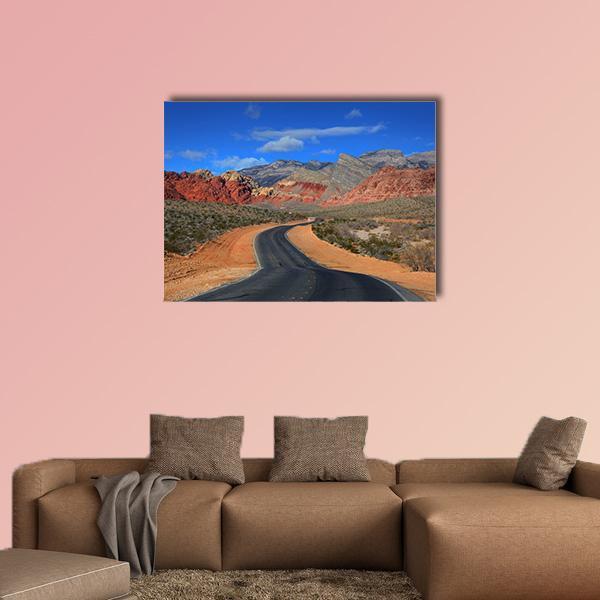 Road to Red Rock Canyon Canvas Wall Art in brown, red and blue, single panel hung on a wall