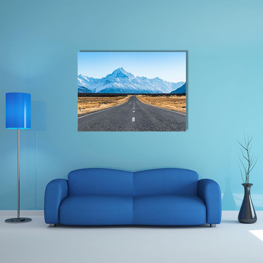 Road to Snow-capped Peak Canvas Wall Art in gray, brown and blue, single panel hung on a wall