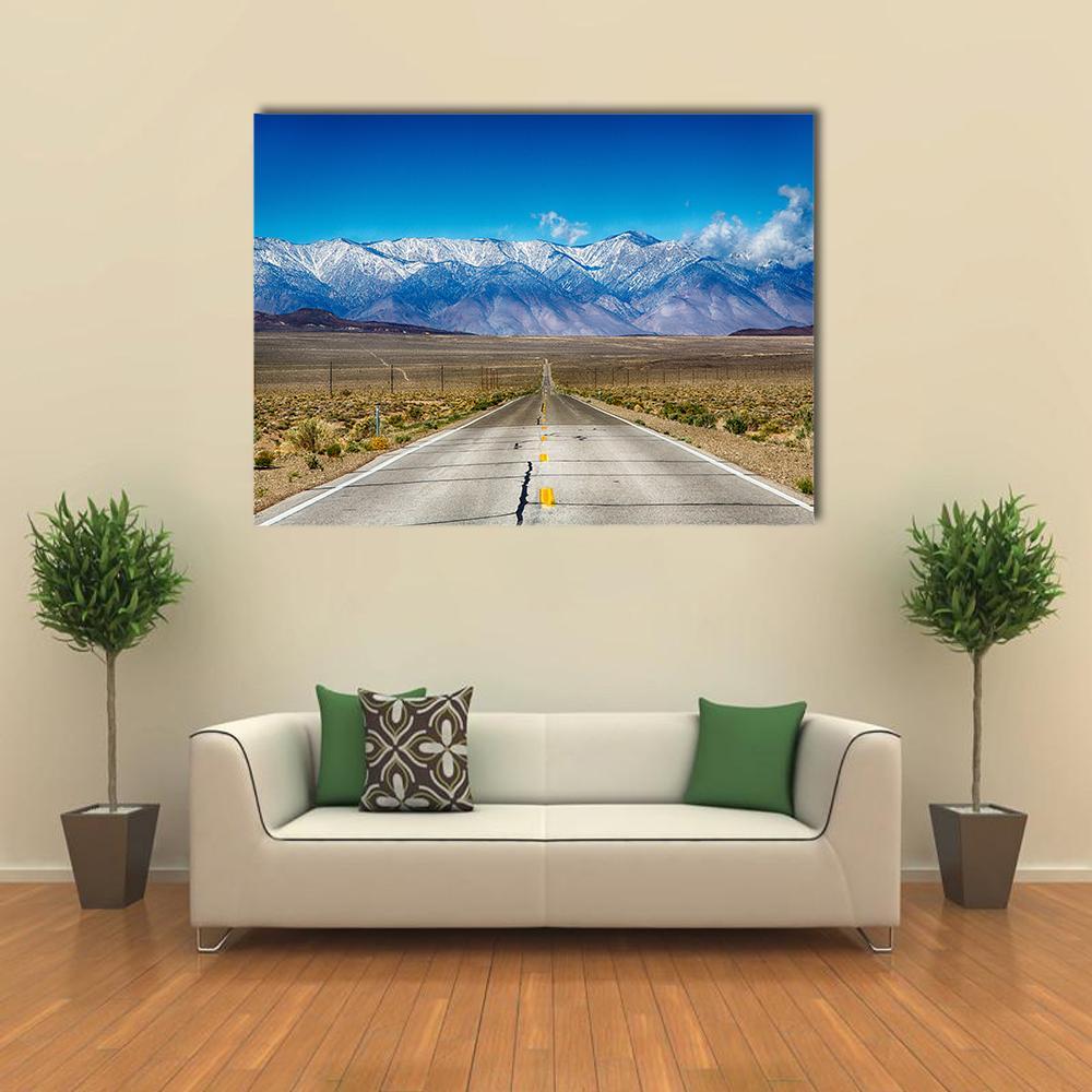 Road Through Eastern Sierra Nevada Mountains Canvas Wall Art in gray, brown and blue, single panel hung on a wall