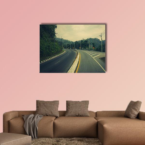 Winding Mountain Road with Caution Signs Canvas Wall Art in gray, beige and green, single panel hung on a wall