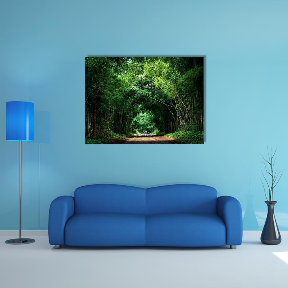 Sunlit Bamboo Path Canvas Wall Art in black, brown and green, single panel hung on a wall