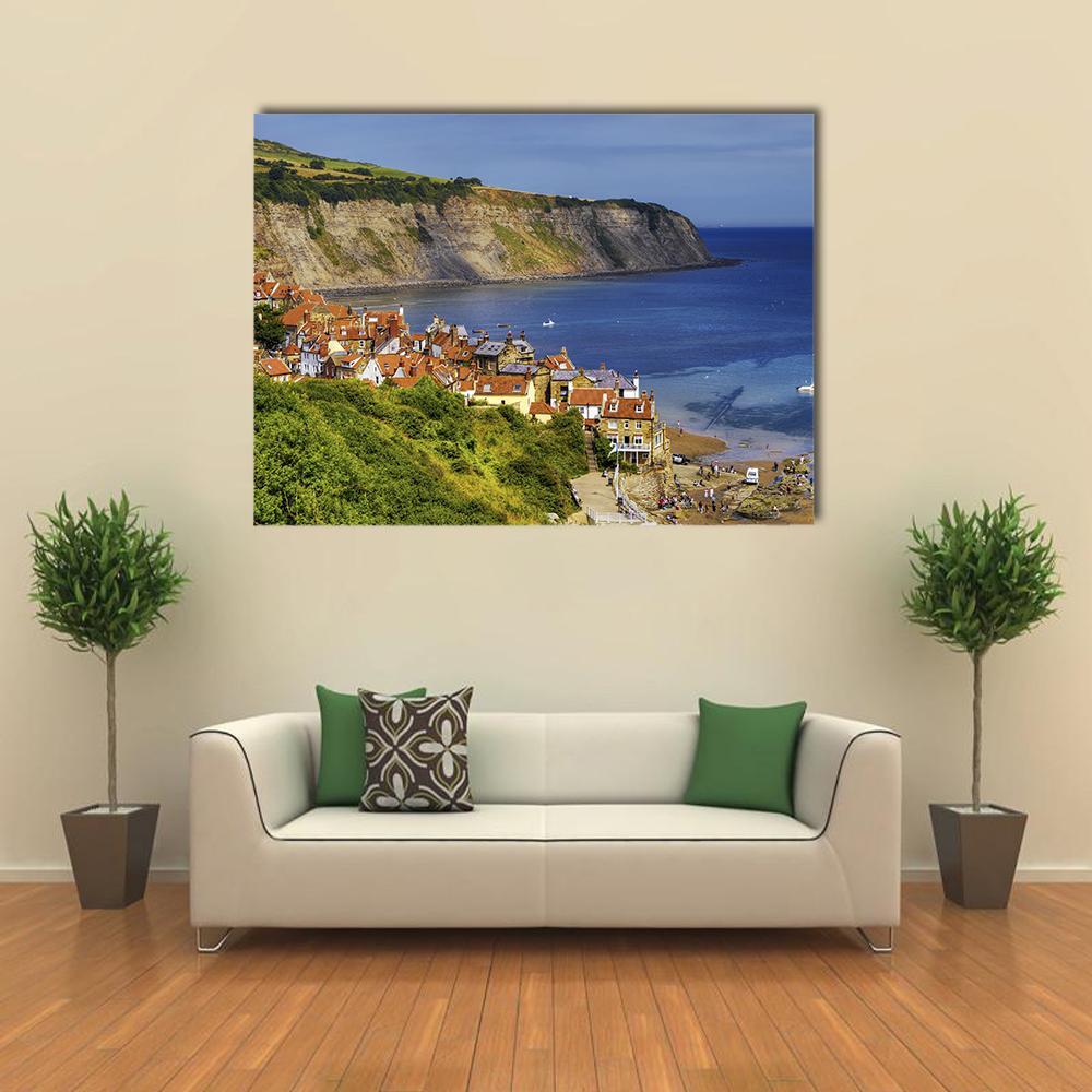 Robin Hoods Bay Village Canvas Wall Art in brown, green and blue, single panel hung on a wall