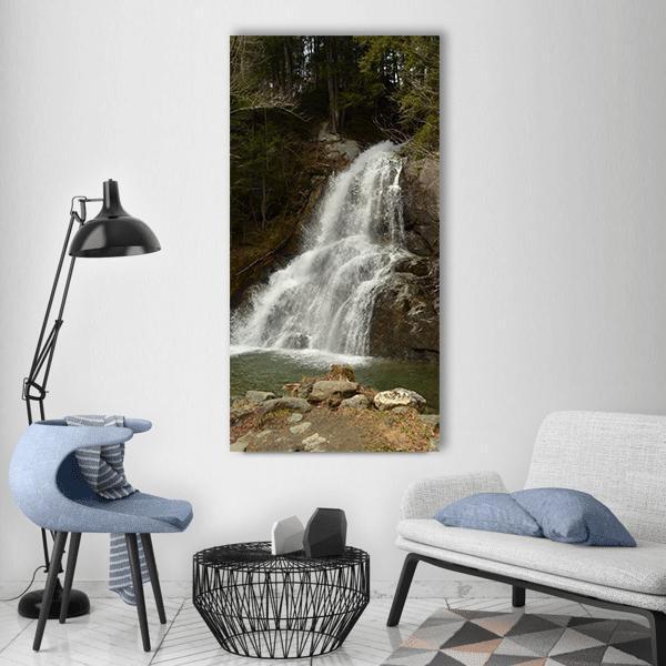 Foaming Rock Waterfall Vertical Canvas Wall Art in white, brown and green, single vertical panel hung on a wall