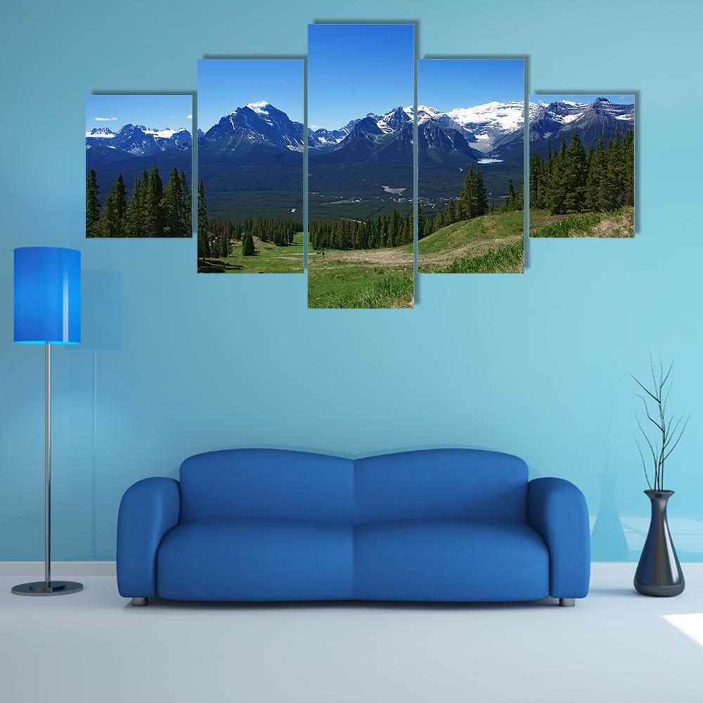 Banff Rockies with Snow-capped Peaks Canvas Wall Art in white, green and blue, 5 panel Star layout hung on a wall